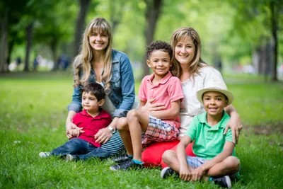 Foster family sitting in nature